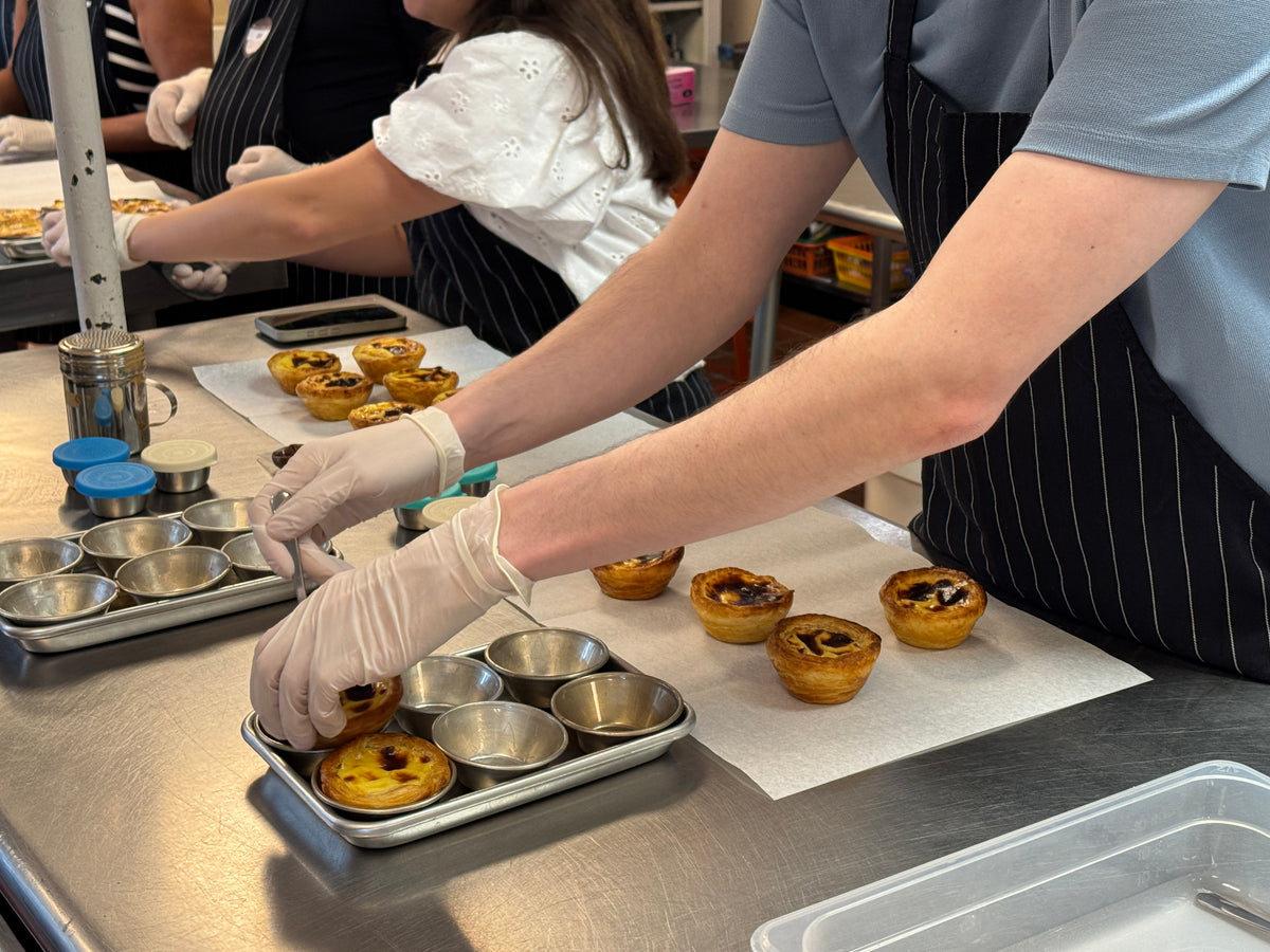 Guests enjoying a DoceHaven Pastel de Nata baking class